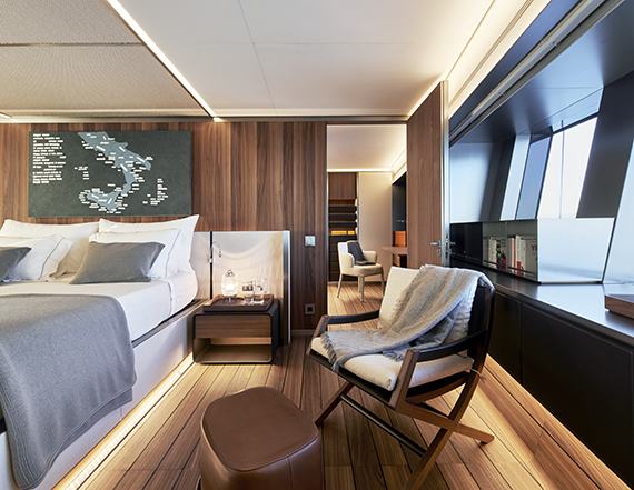 Shipowner's cabin of the Explorer with a work by Emilio Isgrò above the headboard, photo by Leo Torri. Courtesy Sanlorenzo